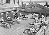 Women staffers on rooftop deck