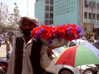 Naw Roz flower seller in front of MoIC (photo by Linda Mazur)